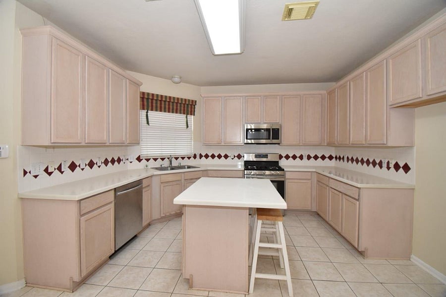 Spacious kitchen with plenty of counter space and kitchen island with extra seating