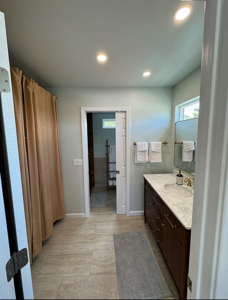 Sink separate from bathroom with a closet