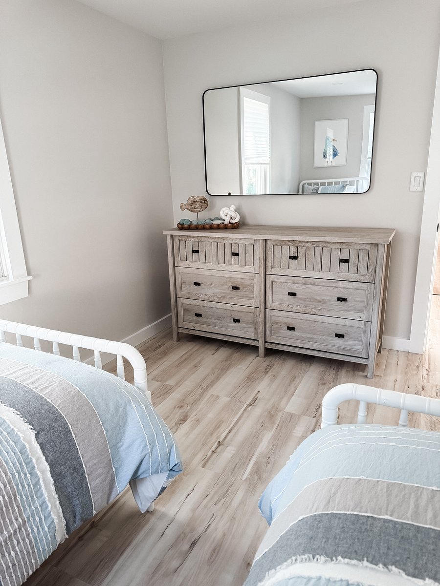 Twin bedroom 3 with large dresser.