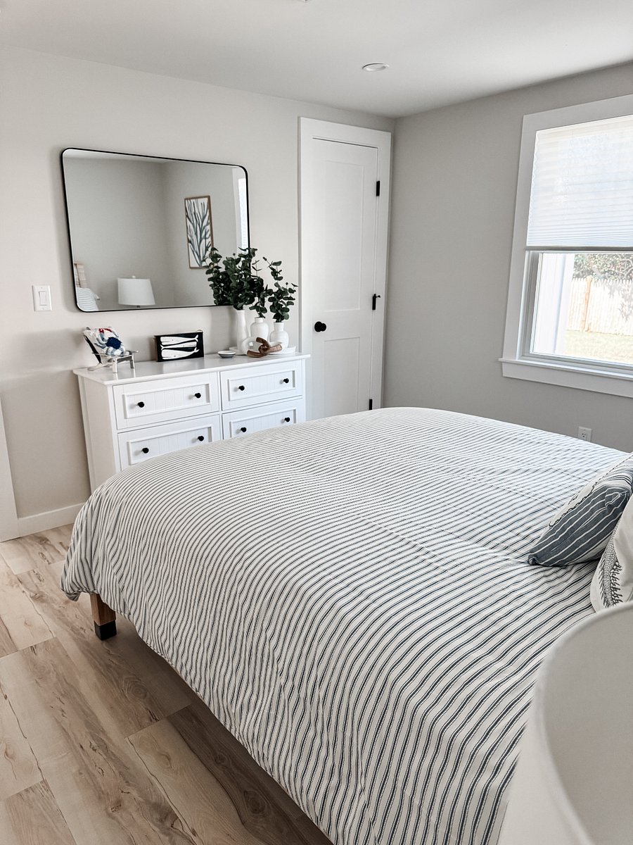 Queen bedroom 2 with large dresser and linen closet in the bedroom.