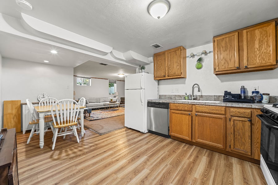 Fully equipped kitchen with full-size appliances and dining table with seating for four.