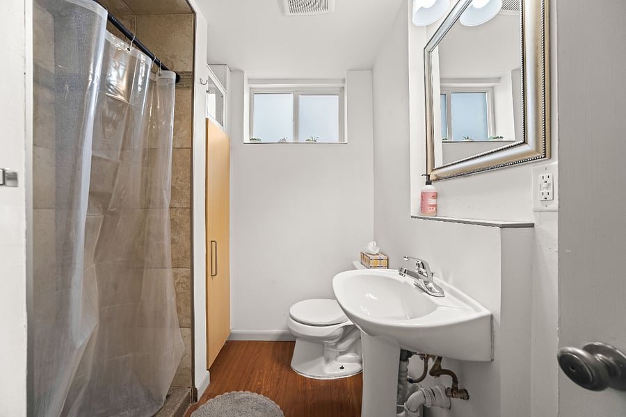 Bathroom with walk-in shower.