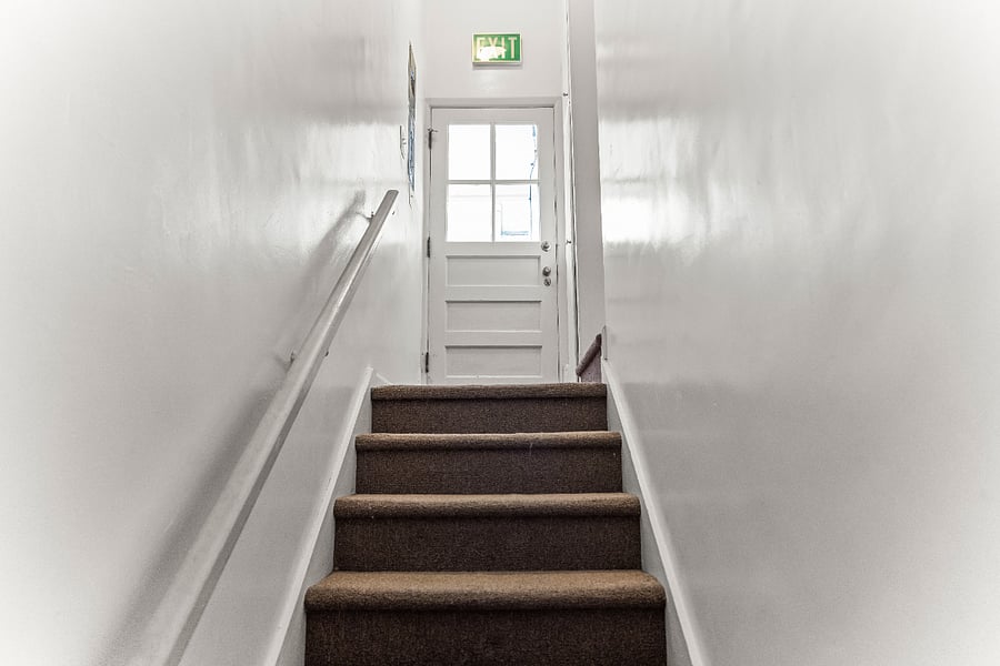 Stair access to the private lower-level unit.