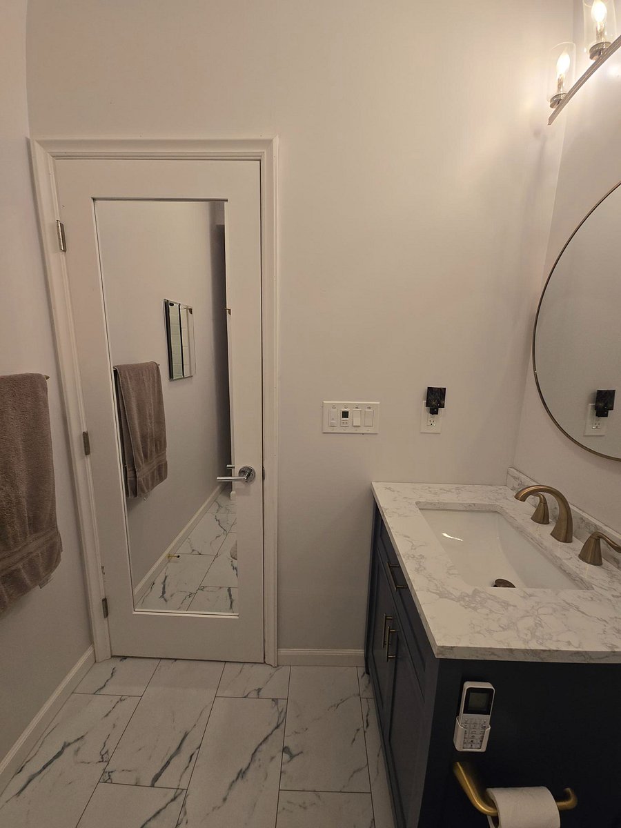 Bathroom view with mirror door