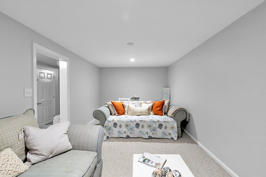 There is a desk behind the couch that can be used for a second office space.