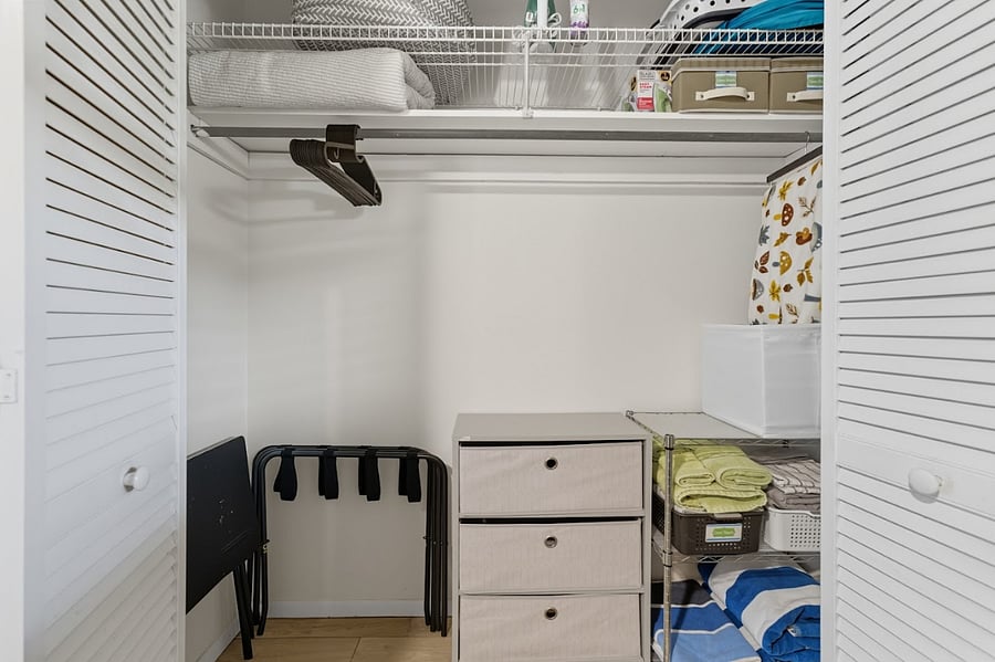 Bedroom closet/Extra sheets and towels/Iron and small ironing board