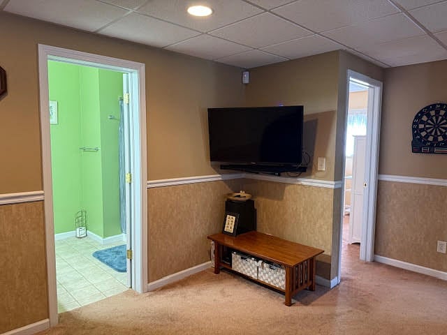 TV area between the bedroom and bathroom, includes Smart TV access with Netflix, Amazon Prime, and Disney Plus
