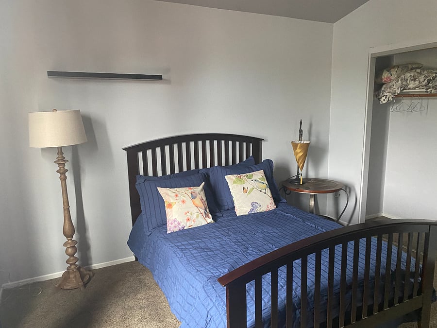 2nd Bedroom for rent is in a medium denium blue with blue gray walls.  New Searsucker bedding.  