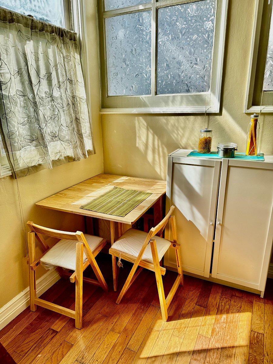 Cozy sunlit table overlooking backyard. Expands to seat 4, also folds down to tuck away.