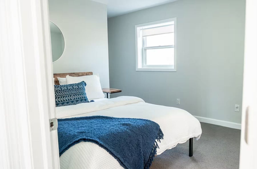 Another view of lower level bedroom with queen bed