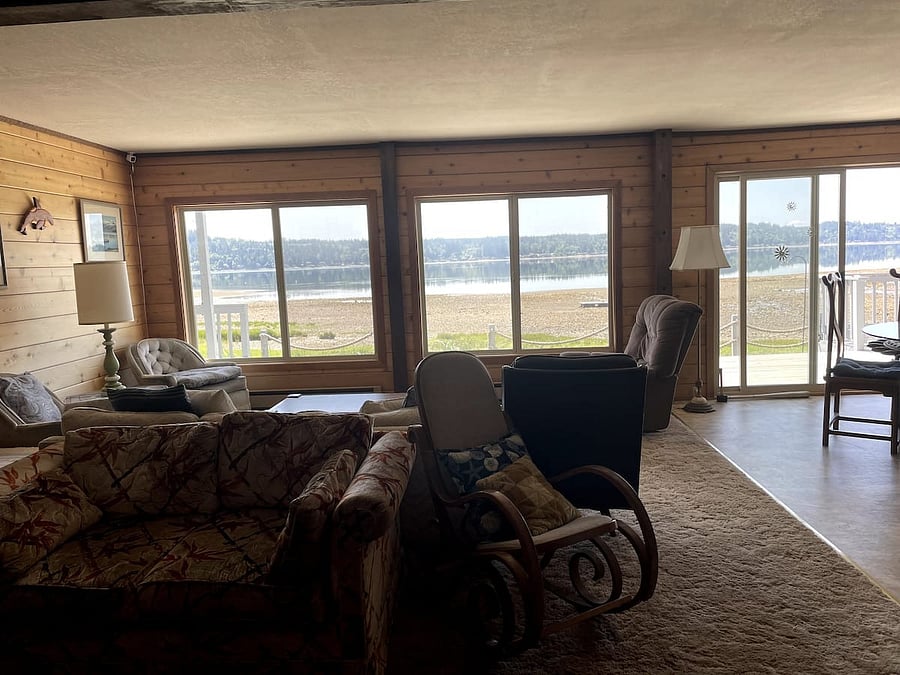 Kitchen, dining area, living room, large wrap-around deck access.