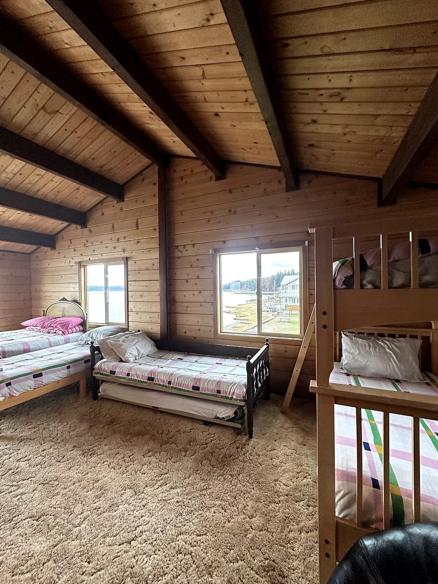 Upstairs bedroom #3. Bunk room with attached deck. Facing Hood Canal.