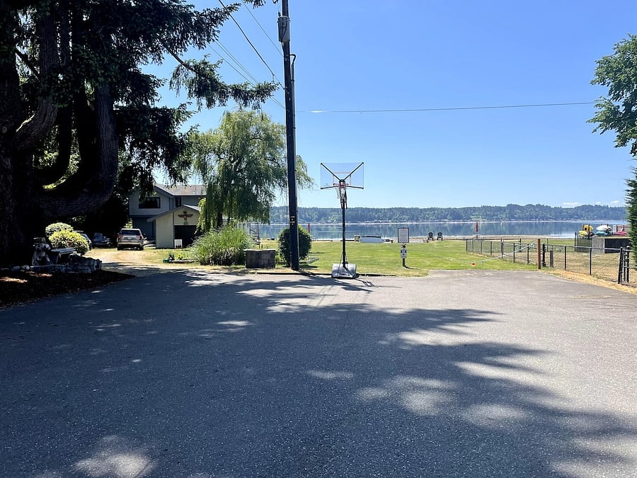 Basketball hoop just steps away from the home that is shared with other community members.
