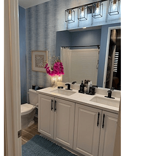 Bathroom with tub and shower, two sinks