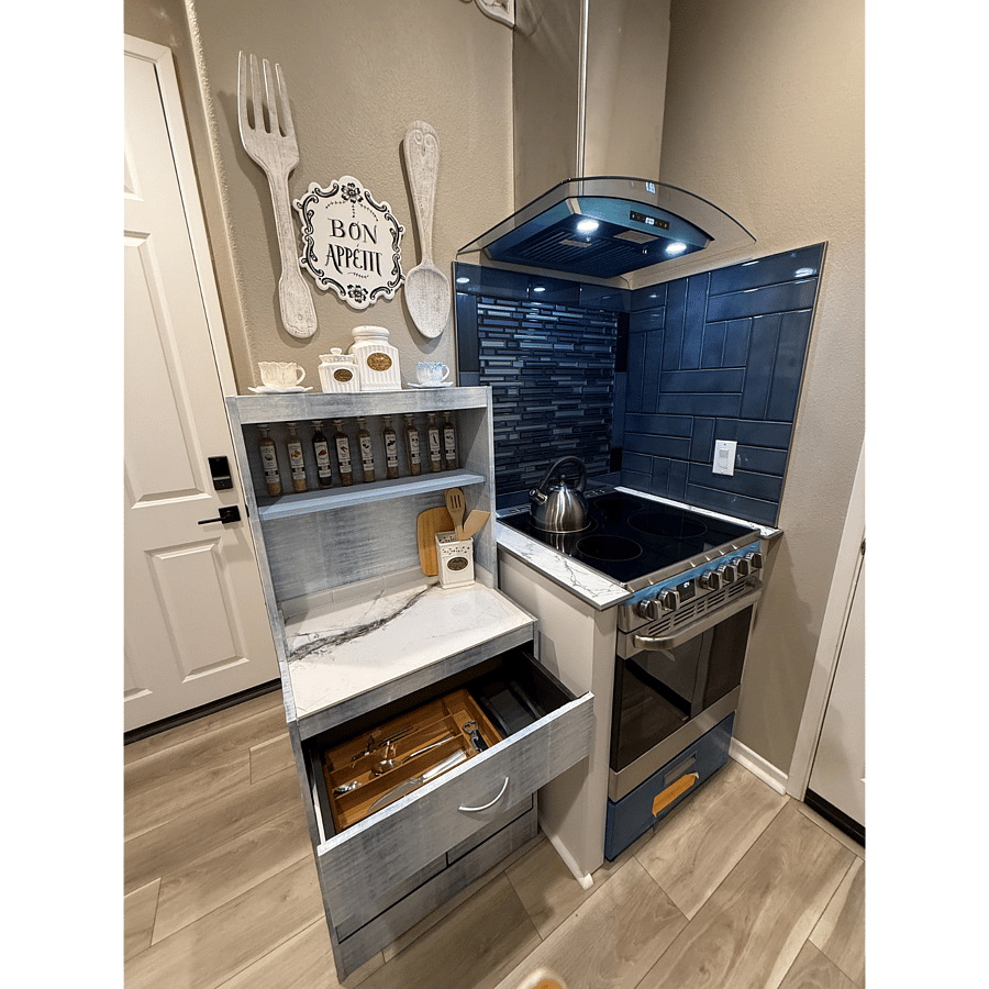 Kitchen electric stove and oven complete flatware set, wine opener, spatula, wooden spoons etc.