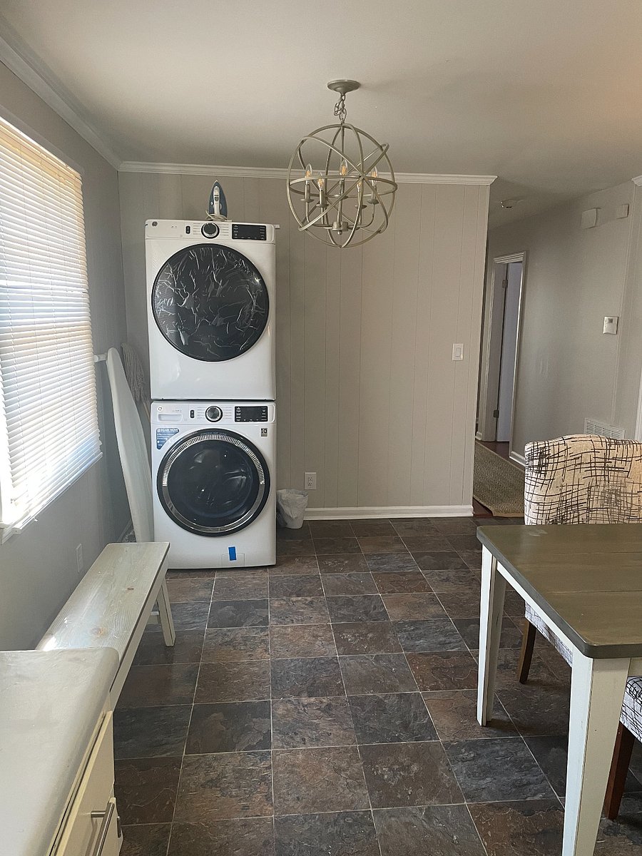 There is a table next to washer