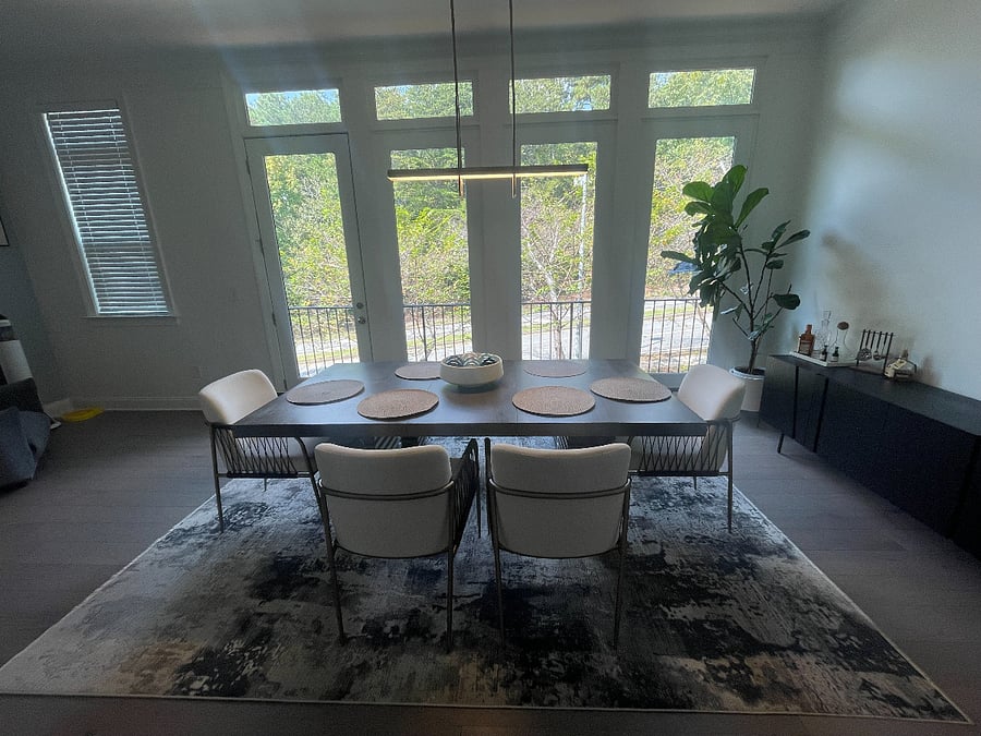 Light-filled dining area opposite the living room, complete with a cozy nook for morning coffee or evening reading.