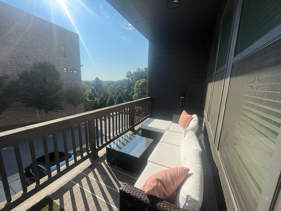 Relax outdoors year-roundcovered balcony with seating and ceiling fan for the perfect balance of shade and comfort.
