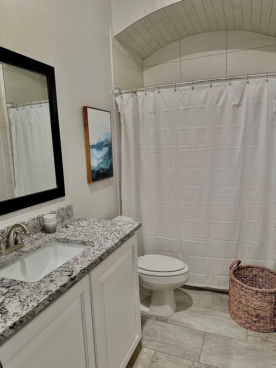 Bedroom 2 and Bedroom 3 share a full bathroom, providing comfort and convenience for guests or children.