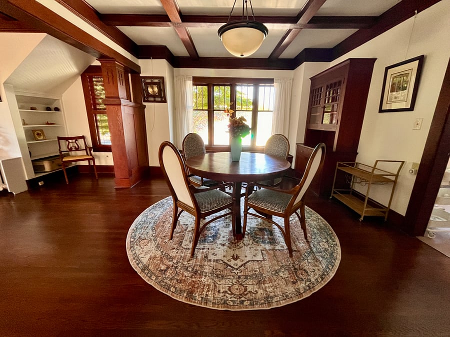 Dining room view with window bench and privacy film on lower windows