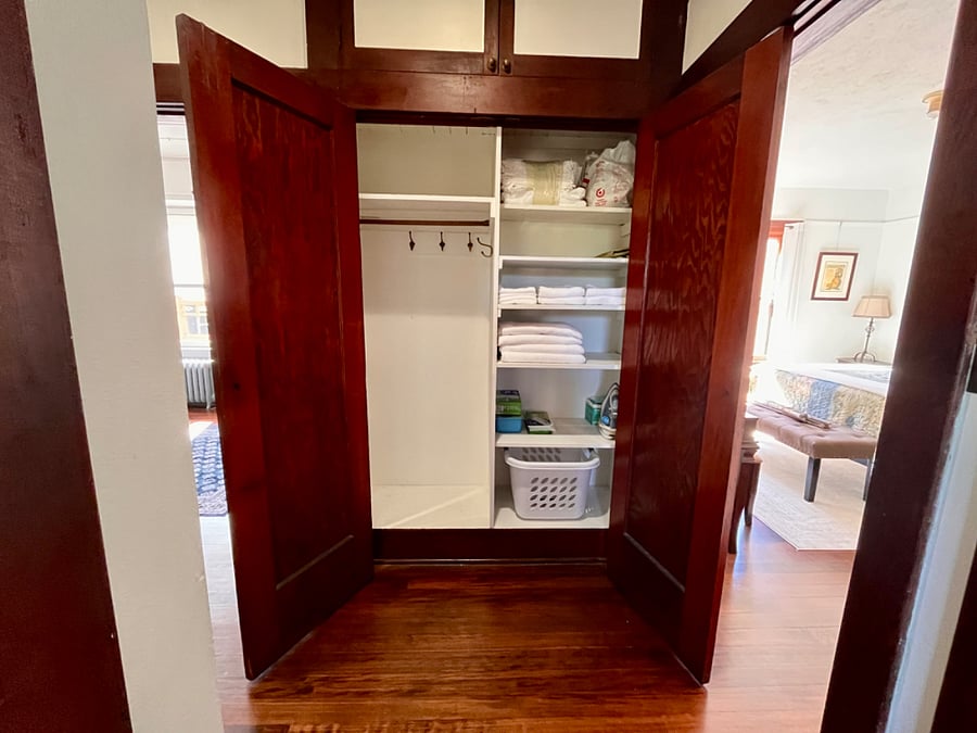 Hall coat and linen closet storage
