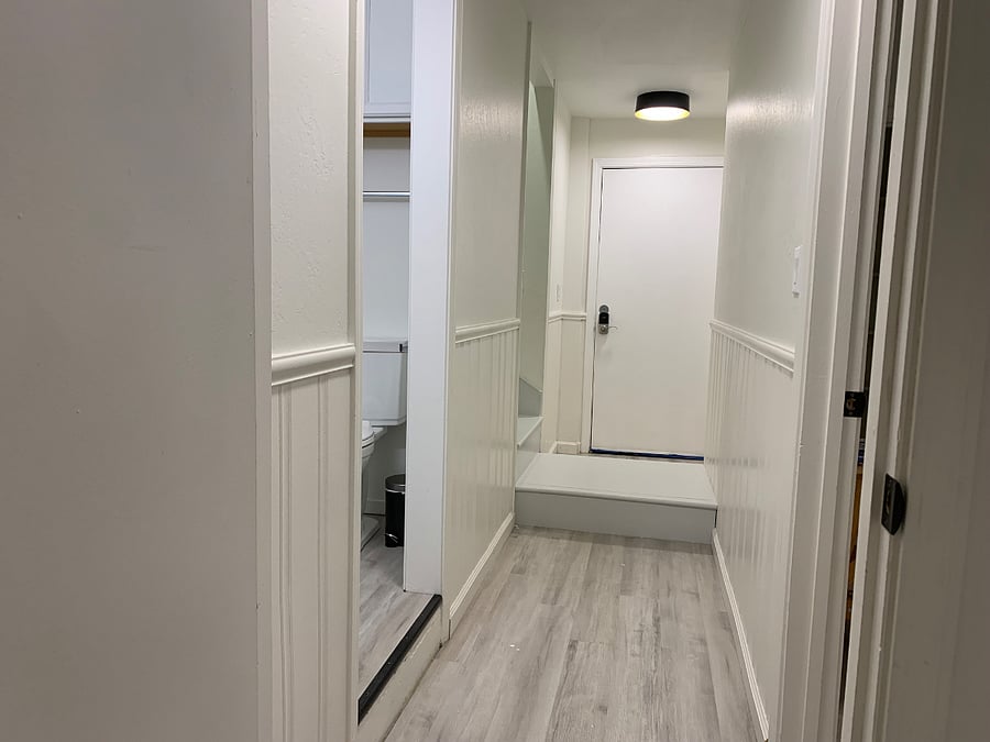 Lower level hallway where 2 of 3 bedrooms are (master and bunk bedroom)
Looking towards main front door