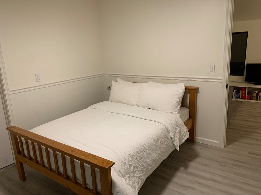 Upper bedroom with full bed. Also has sliding door to back deck to hot tub