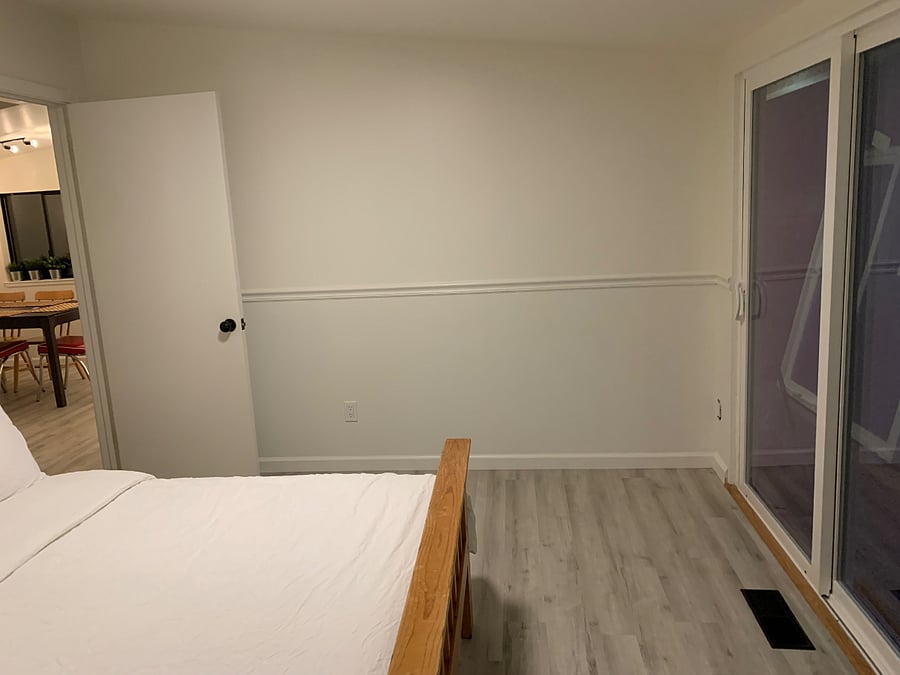 Upstairs bedroom to living area and sliding door to back deck/hot tub/ spare room and laundry area