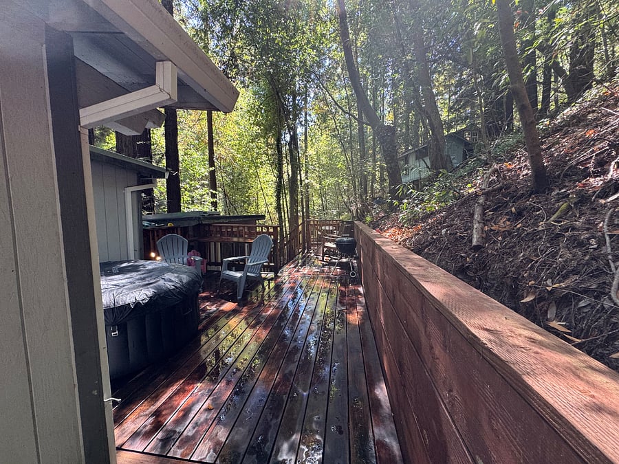 Walking onto upper rear deck with hot tub