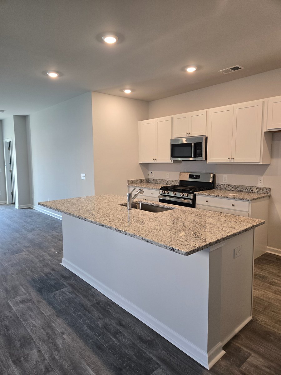Spacious kitchen with granite countertops