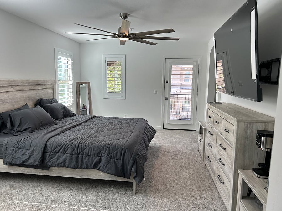 Master bedroom with direct balcony access. Coffee bar, Mini fridge, and microwave in Master. Huge his and her closet