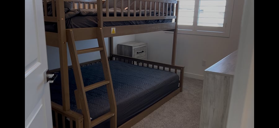 Full XL over Queen bunk bed.
55 inch smart tv mounted on wall