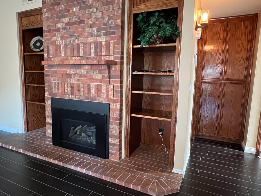 Great room - beautiful wood build in shelves, gas fireplace