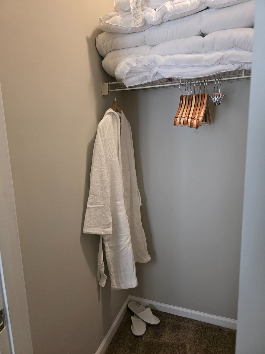 Relax and recharge  robes and slippers await, and the walk-in closet is stocked with an iron, ironing board, and handheld steamer for your convenience.