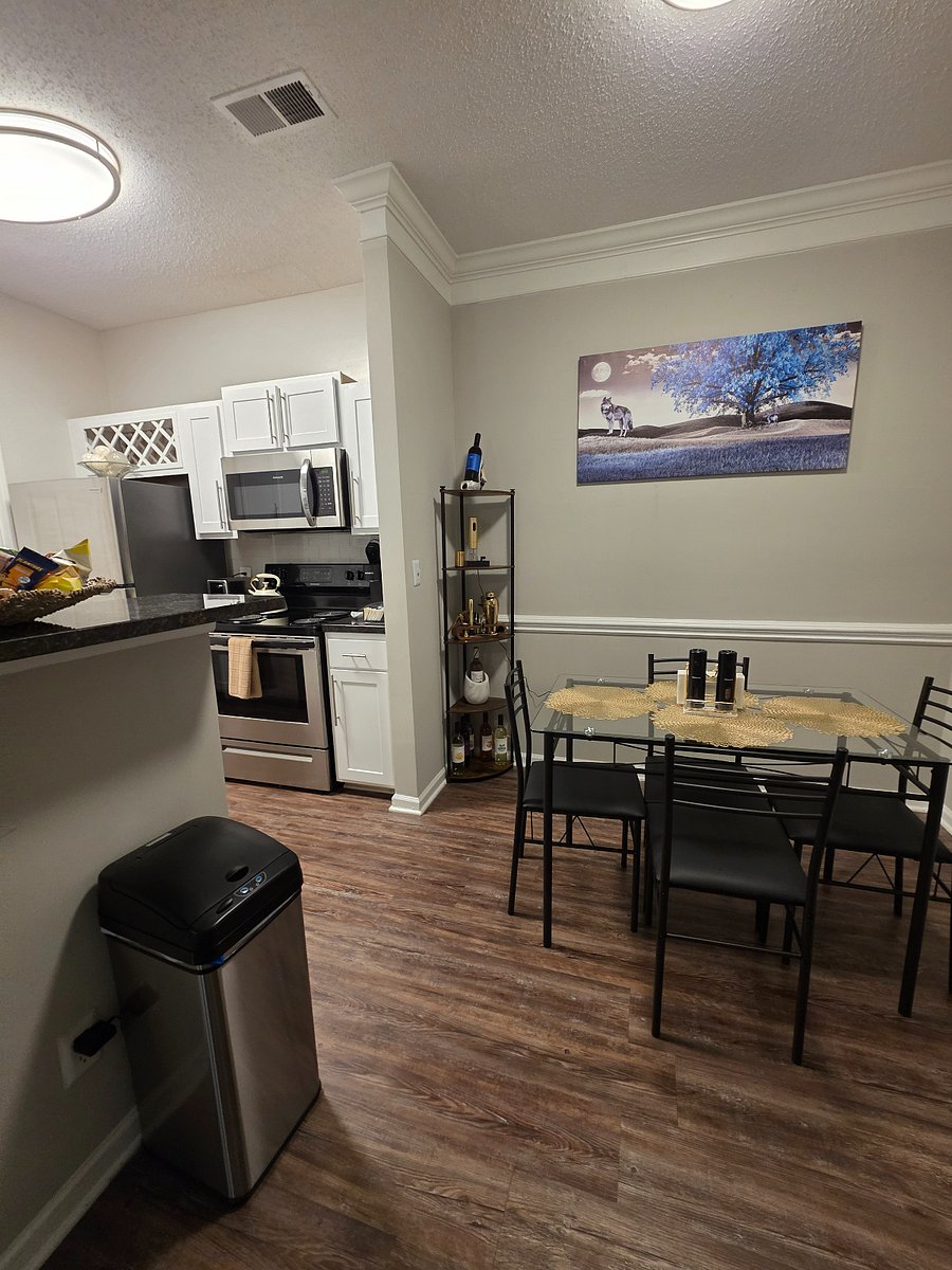 Dining table seats four ideal for meals and meaningful moments, not laptops.