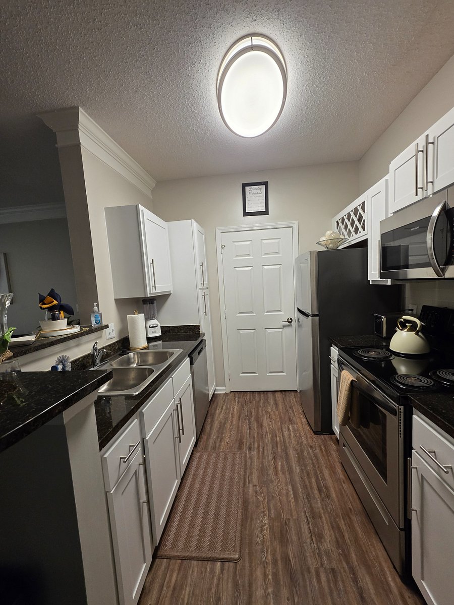 Fully stocked kitchen with everything you need and still part of the conversation thanks to the open layout. 
Laundry room is located just beyond the door for added convenience.