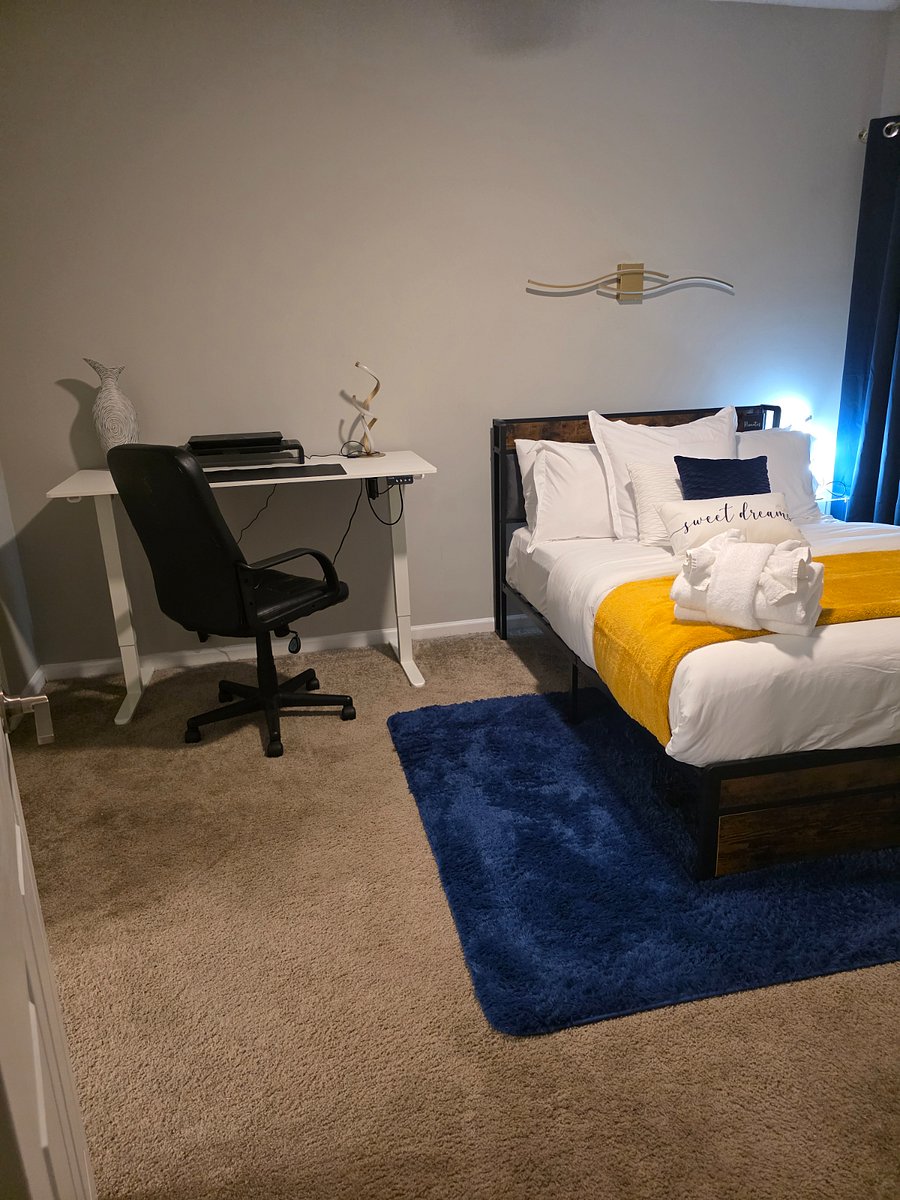 Designed for comfort and productivity, the second bedroom includes a full-size bed, blackout curtains, a private ensuite, and a sit/stand desk that adapts to your remote work routine.