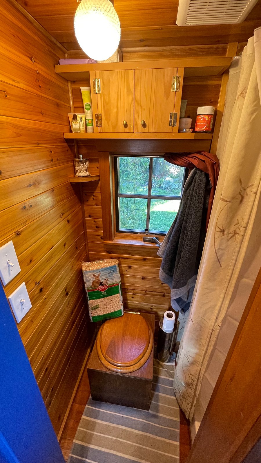 Bathroom with composting toilet and shower