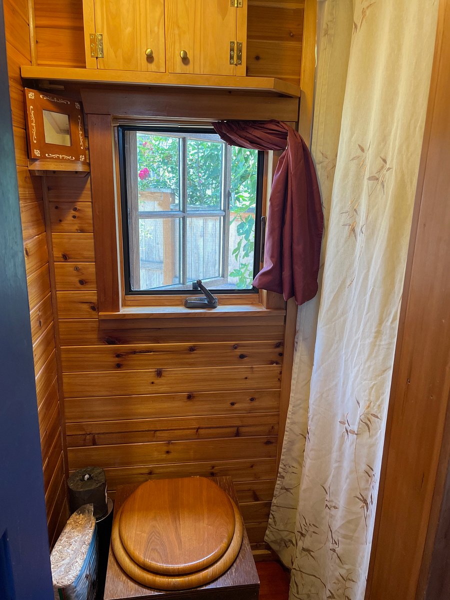 Bathroom with door and 3 foot x 3 foot shower with on demand hot water heater.