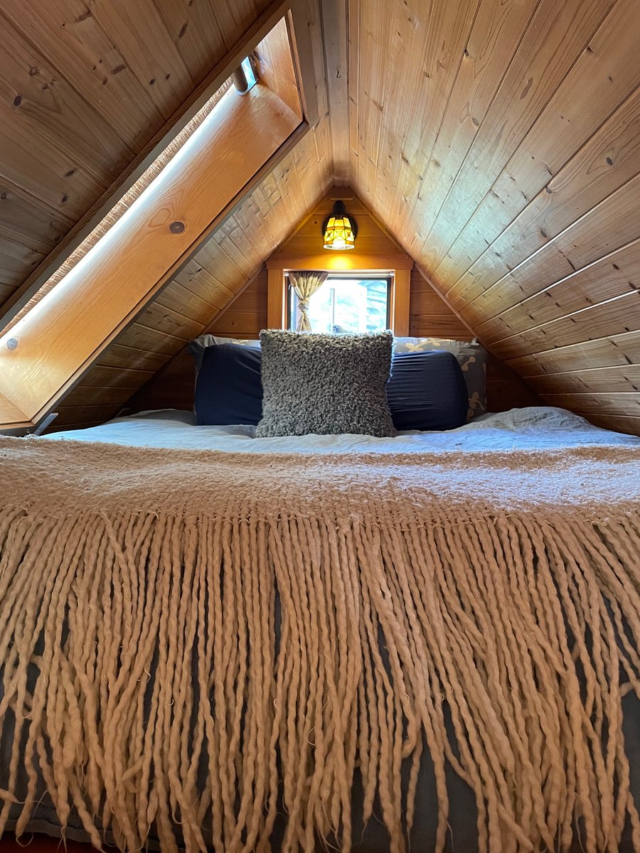 Queen size bed in loft. Two sets of sheets and duvet with cover provided and pillows. Washer and dryer provided in laundry shed attached to main house where there is additional storage.