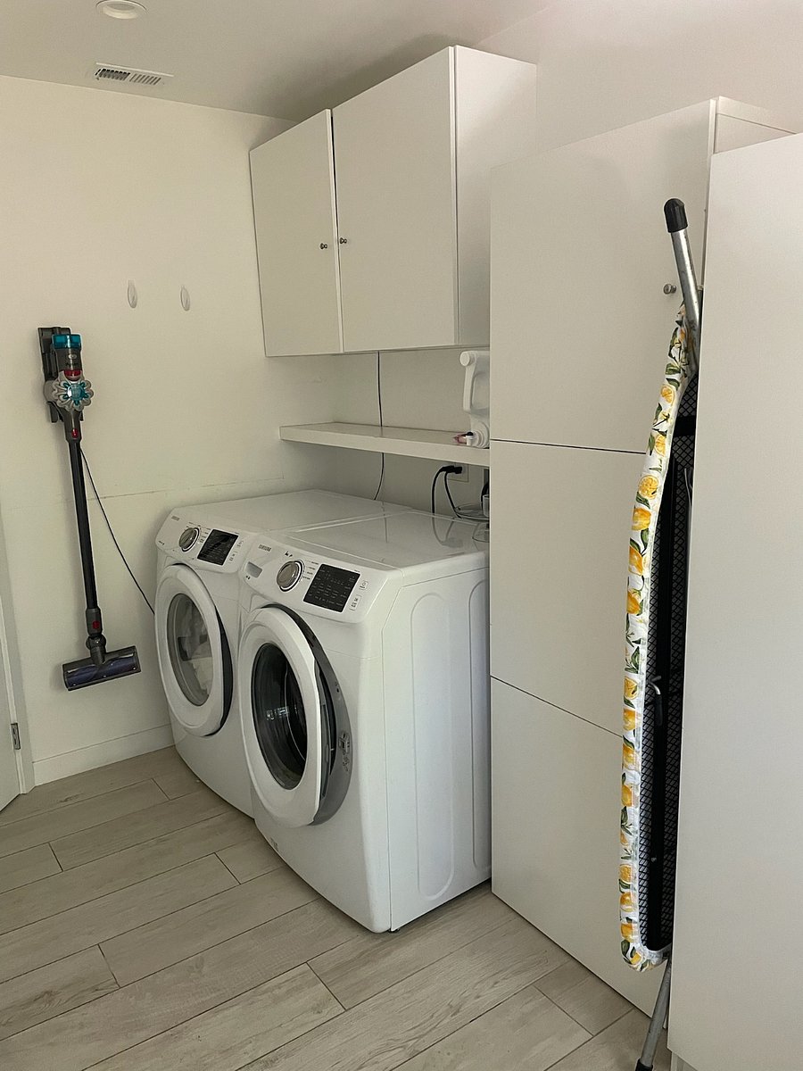 Laundry Room - with Washer, Dryer, iron, and vacuum cleaner