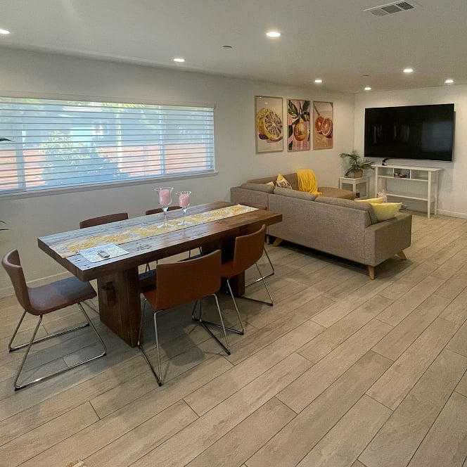 Living area with big screen TV, Roku Stick, comfy seating for 6