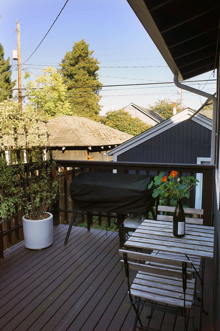 Backyard deck for grilling in the summertime, easy access to indoor kitchen