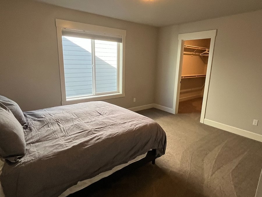 Same Guest Bedroom with Queen Bed (Showing Large Walk-in Closet)