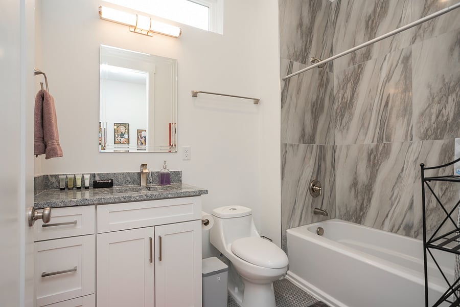 Guests have access to this bathroom via the third bedroom or through the hallway. 