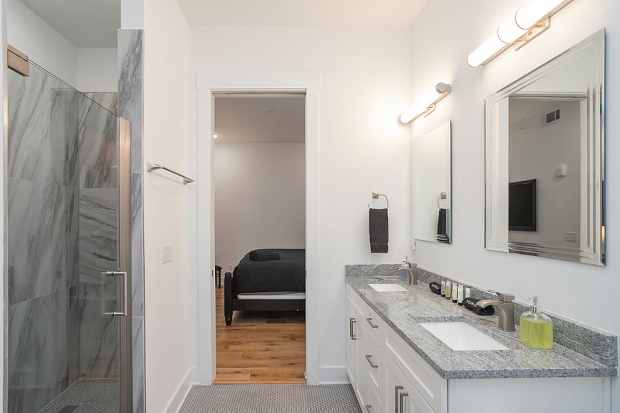 Large ensuite bath with double vanity and large walk-in shower. Plenty of room to get ready. Large closed at end of bathroom.