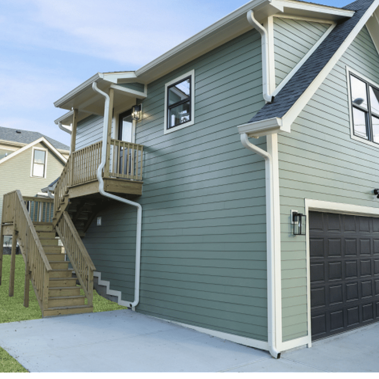 Parking pad-unit is above the garage. No garage parking!