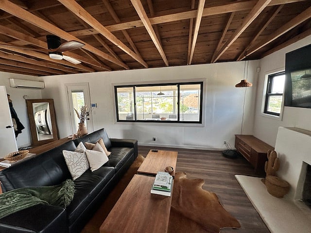 Living room with Large 9 foot window with amazing views! Kitchen and little dining table nook