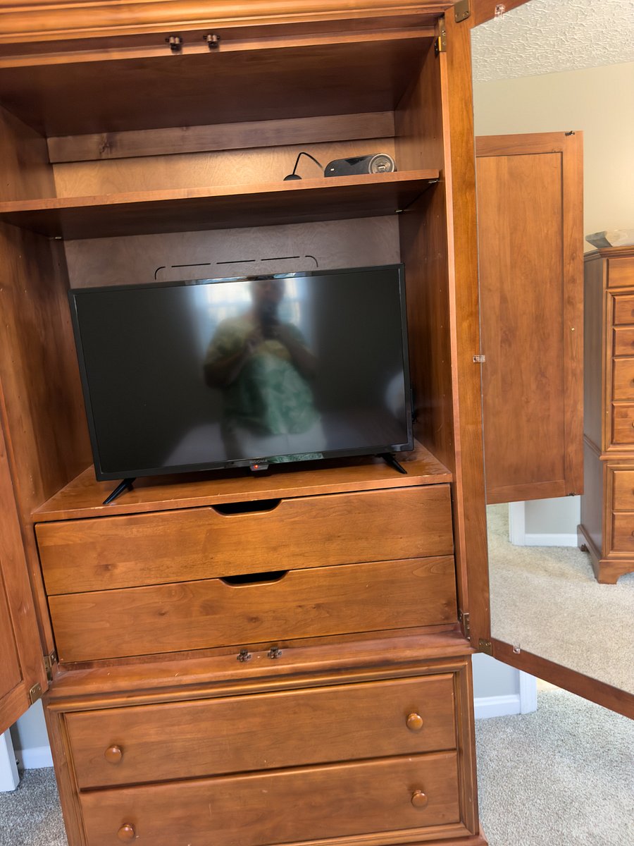 Master wardrobe cabinet with tv. Wardrobe and dresser hold lots of clothes.