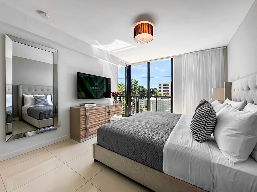 Relax in a spacious master bedroom featuring a comfortable king-size bed and a private in-room bathroom for your convenience and privacy.